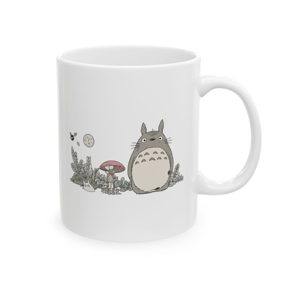 Black ceramic mug with a tan base and a black handle. The mug features a graphic of a character from the animated film "My Neighbour Totoro" with a rainy scene. The mug is on a neutral surface